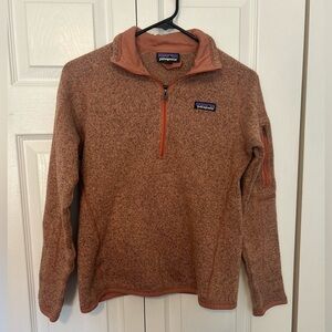 Women’s Patagonia 1/4 zip in rust. Size small.
